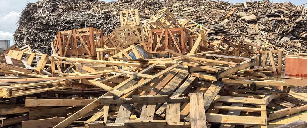 Piles of broken pallets and wood to be recycled