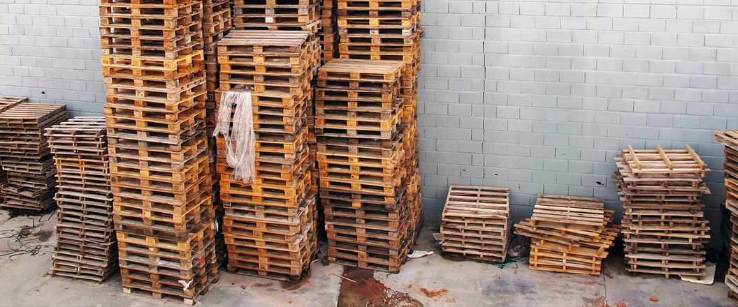 Stacks of pre-recycled wooden pallets
